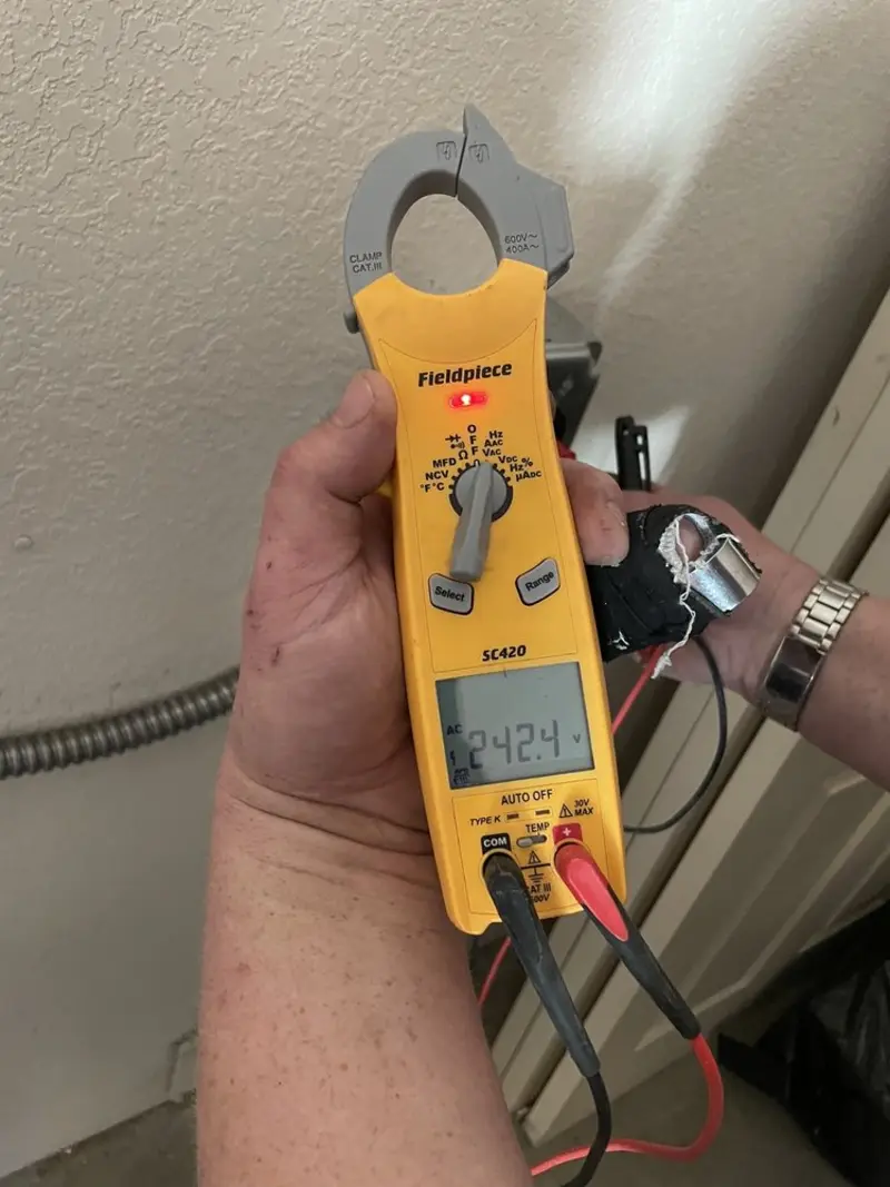 Voltage testing with clamp meter during Outlet Installation in Blackstone